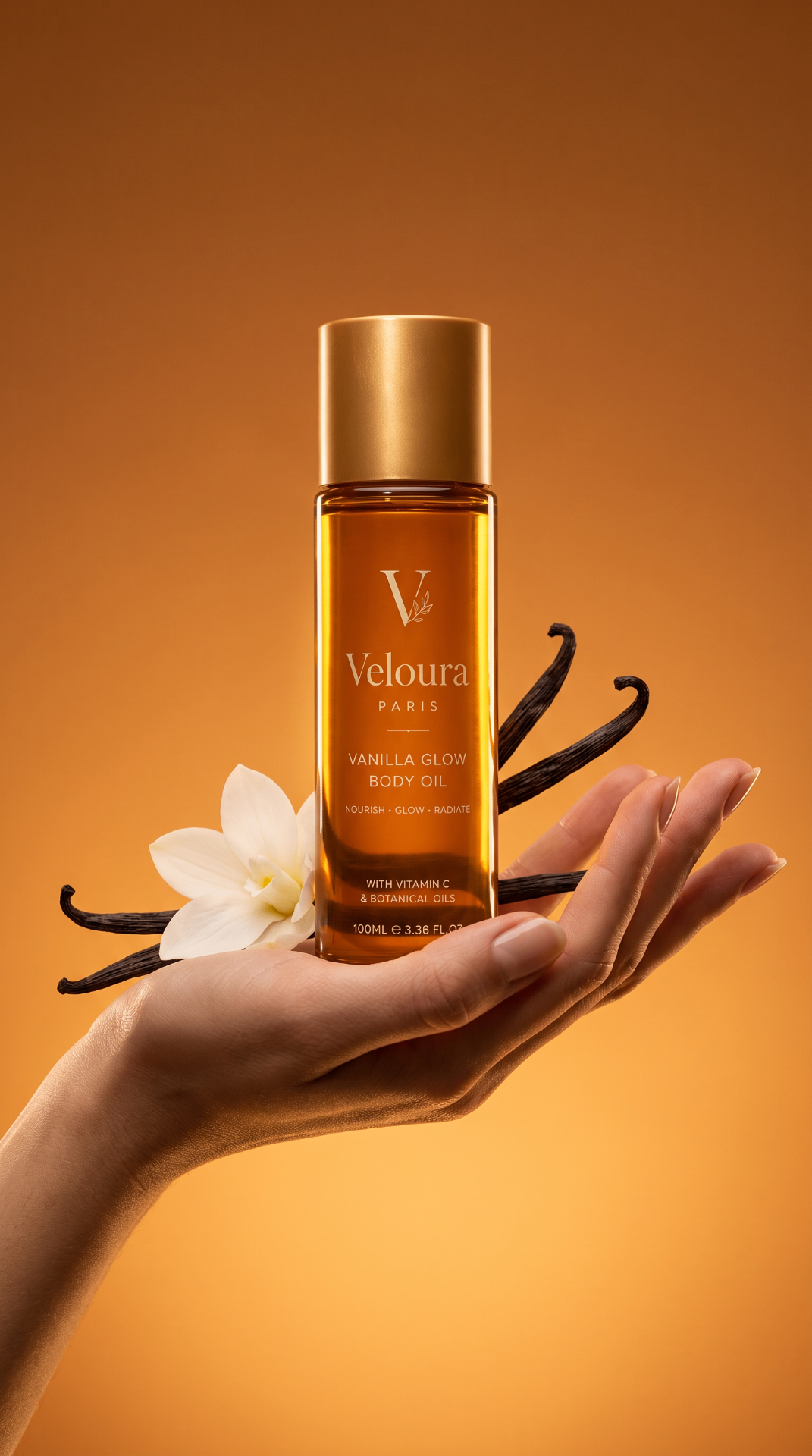 Veloura Paris Vanilla Glow Body Oil held in hand